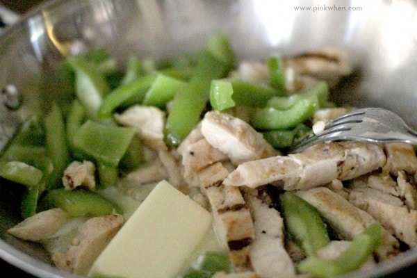 Easy Chicken Enchiladas Recipe prep with butter, chicken, and bell pepper. 