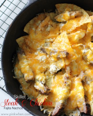Nachos with Chicken, steak, and cheese in a skillet. 