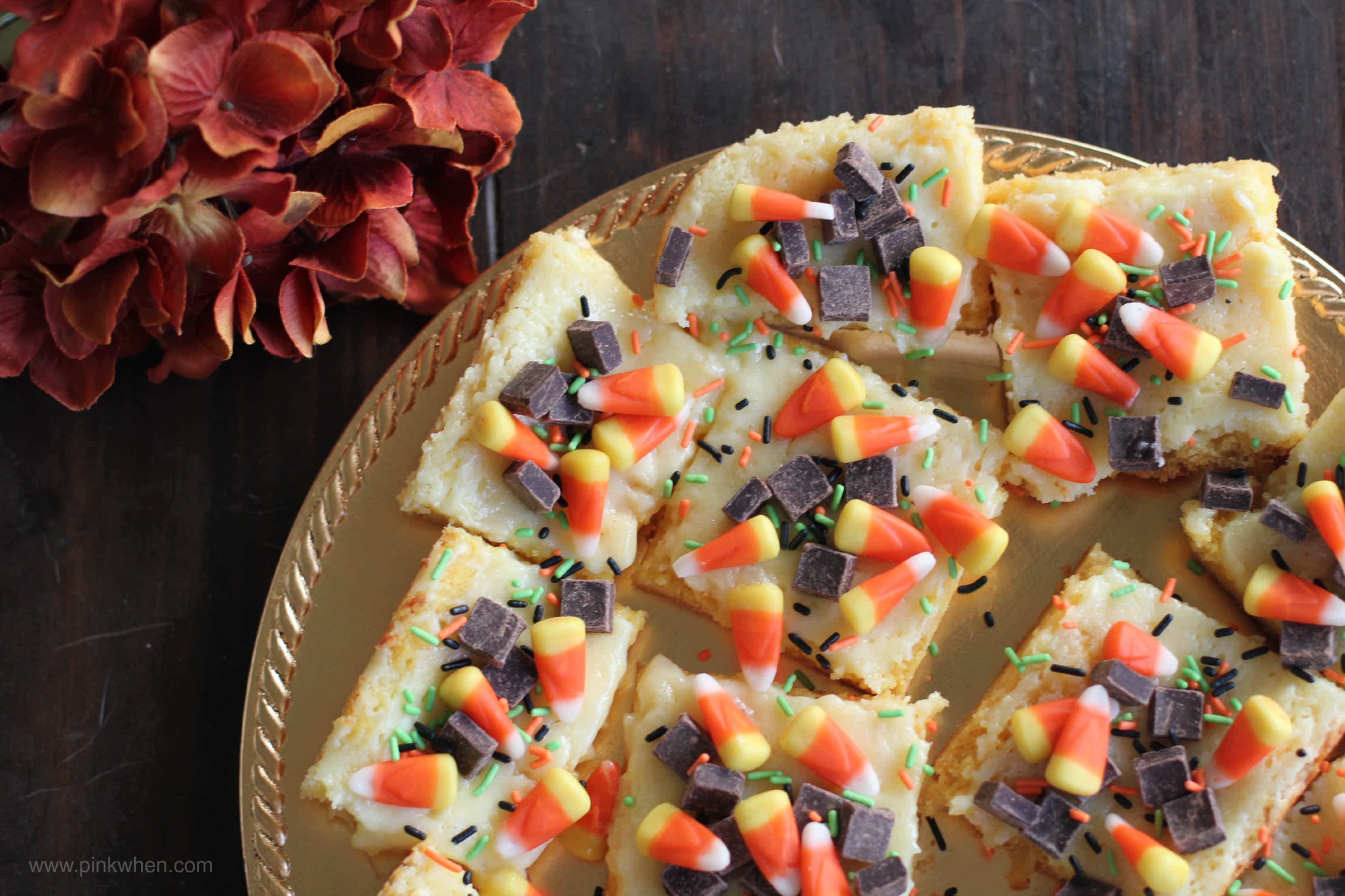 Fall Inspired Ooey Gooey Cake Mix Cheesecake Bars via PinkWhen.com 1