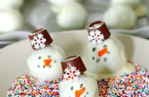 OREO Snowman Cookie Balls on a white plate.