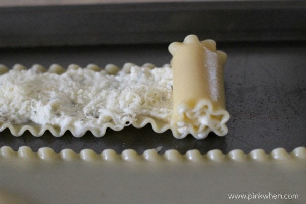 Lasagna Roll Ups being rolled together.
