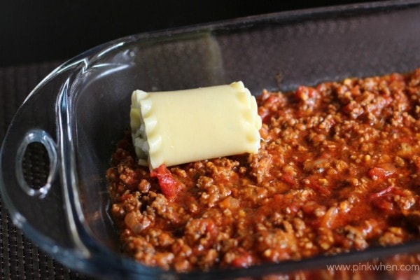 Lasagna roll sitting on top of meat sauce