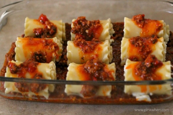 Lasagna Rolls covered in meat sauce. 