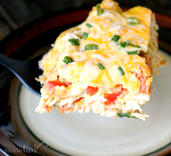Chicken enchilada casserole on a spatula