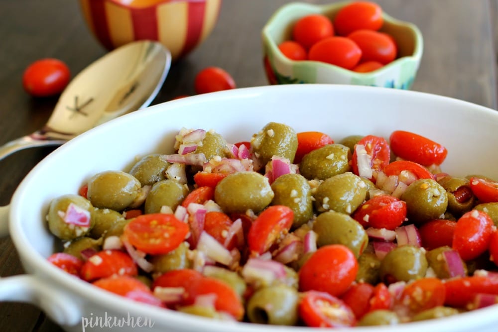Marinated Olive and Grape Tomato Salad in a white dish.