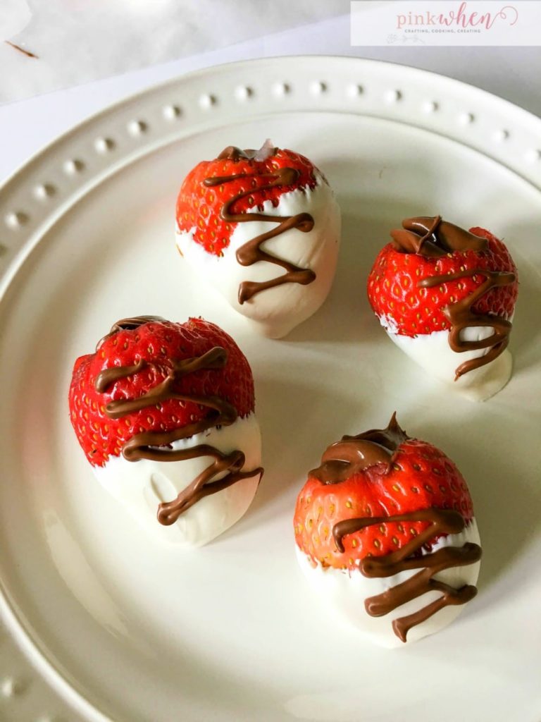 I love Nutella, and I love chocolate covered strawberries, so when you mash these two together, you get a DELICIOUS nutella stuffed chocolate covered strawberry treat.