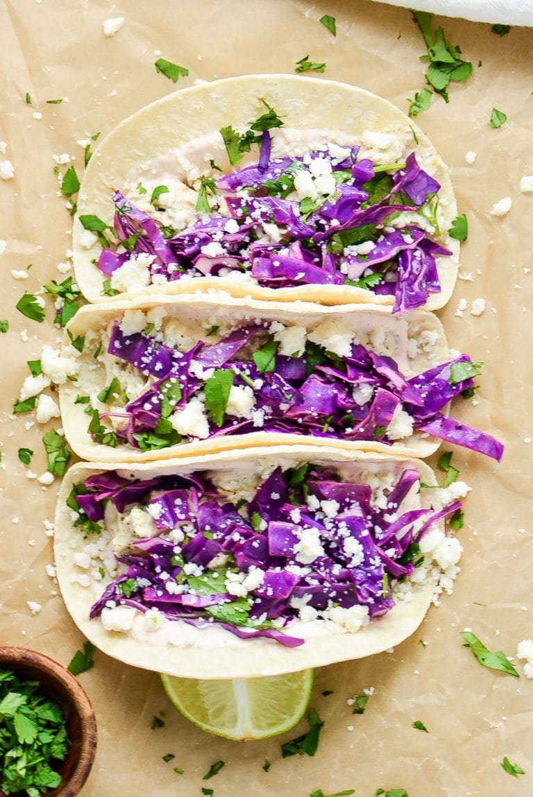 Slow Cooker Salsa Verde Chicken Tacos are an easy and delicious weeknight meal you can throw in your crock pot and be done! Come home to this amazing dish, and then thank me later. 