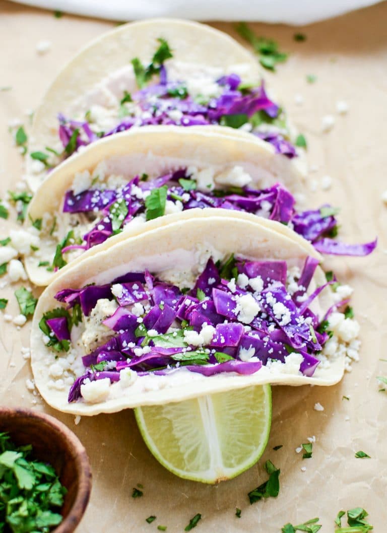 Slow Cooker Salsa Verde Chicken Tacos are an easy and delicious weeknight meal you can throw in your crock pot and be done! Come home to this amazing dish, and then thank me later. 