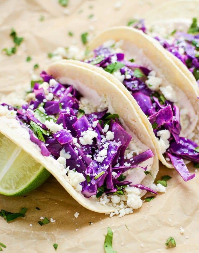 Slow Cooker Salsa Verde Chicken Tacos are an easy and delicious weeknight meal you can throw in your crock pot and be done! Come home to this amazing dish, and then thank me later. 