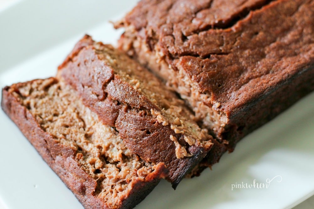 This skinny chocolate banana bread recipe is on a white serving dish. 