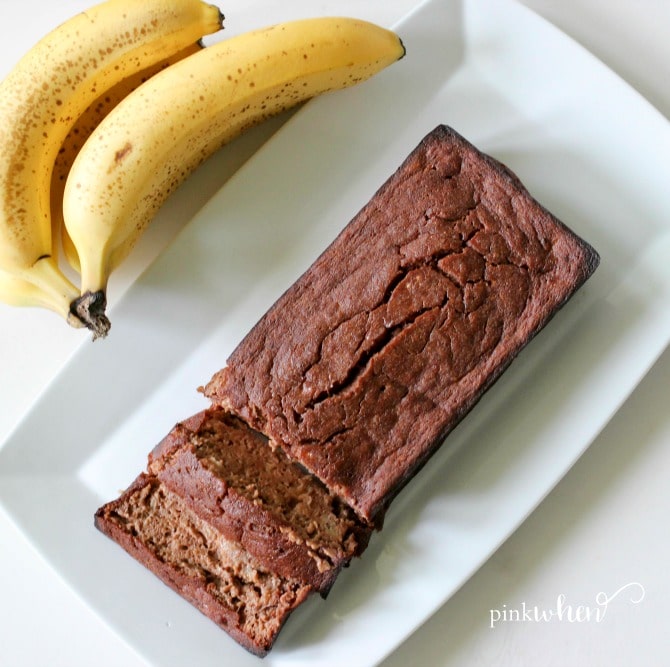 This skinny chocolate banana bread recipe is on a serving dish and sliced. 