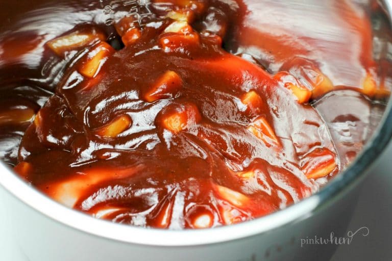 Chicken covered in barbecue sauce with pineapple. 