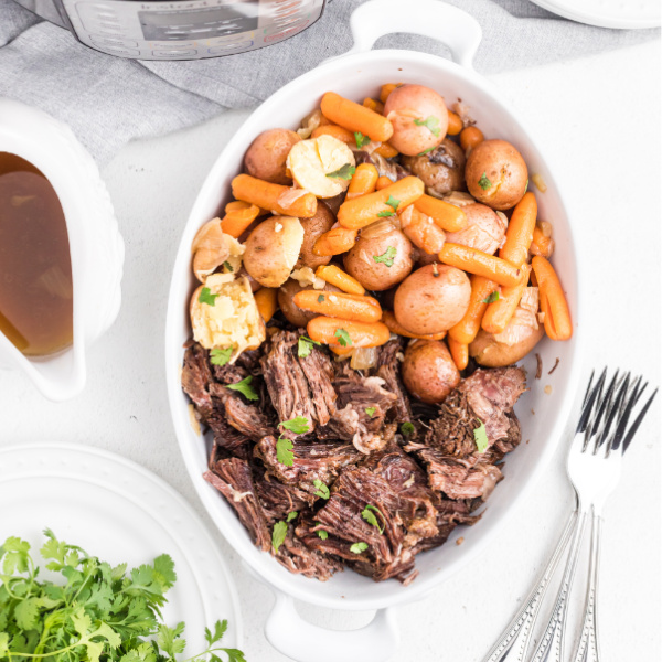 Instant Pot Pot Roast in a dish and ready to serve.