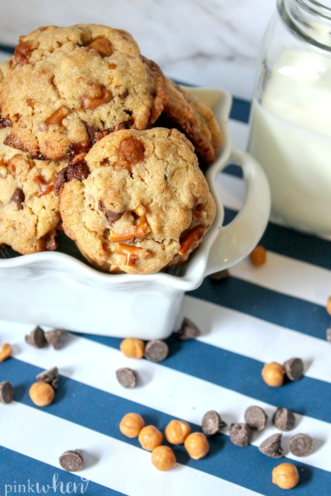 Chocolate, pretzels, and caramel cookies in a white dish.