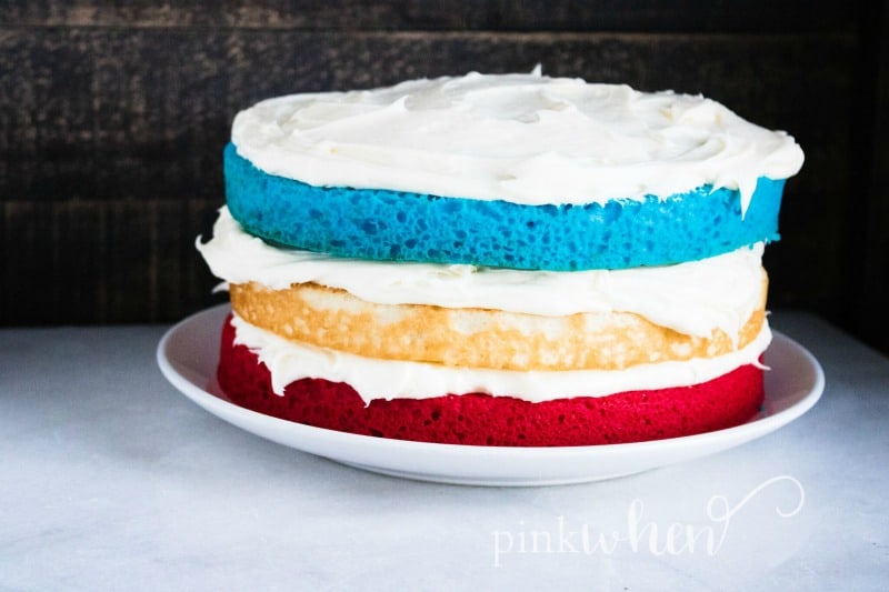 This is such a fun and easy dessert to bring to your summer festivities! This Red White & Blue Patriotic Layer Cake is sure to have everyone excited about summer. 