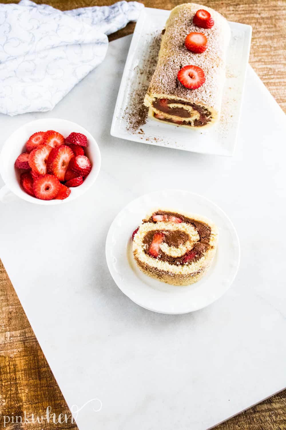 This is one of our new favorite dessert recipes - full of delicious chocolate strawberry flavor! This chocolate ganache cake roll recipe is so sweet, spongey, moist, and delicious! This chocolate roll cake will easily become a favorite in your household!