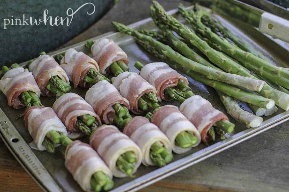 Quick and easy bacon wrapped asparagus. The perfect addition to any menu for the grill. #bacon #asparagus #sidedish #grilledrecipe