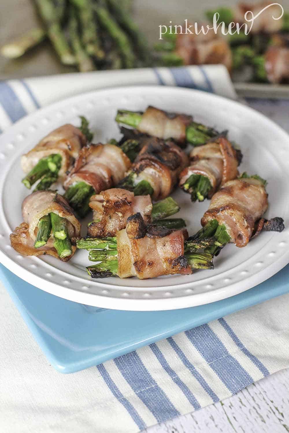 Quick and easy bacon wrapped asparagus. The perfect addition to any menu for the grill. #bacon #asparagus #sidedish #grilledrecipe