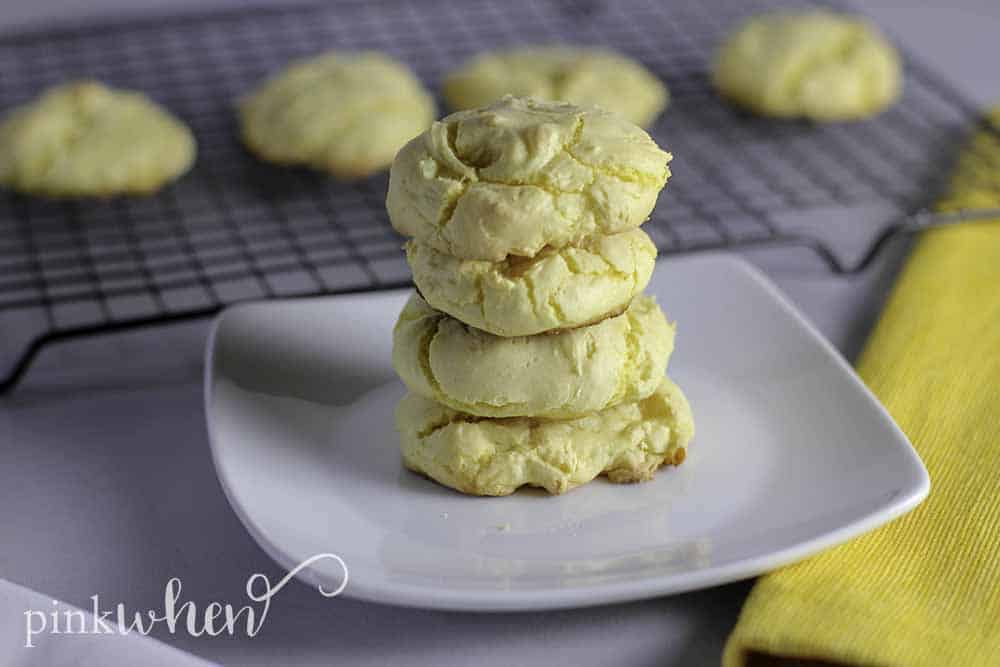 Lemon Cake Mix Cookies stacked on a white plate. 