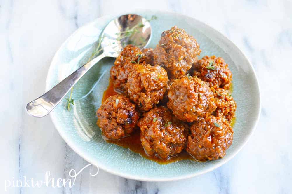 Meatballs on a plate with a spoon. 