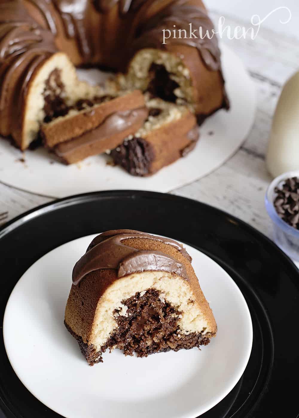 Hershey chocolate filled bundt cake on plates on wooden table.