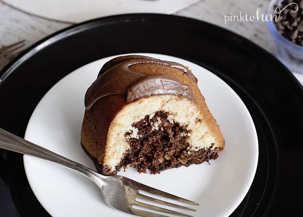Slice of Hershey chocolate bundt cake on a white plate.