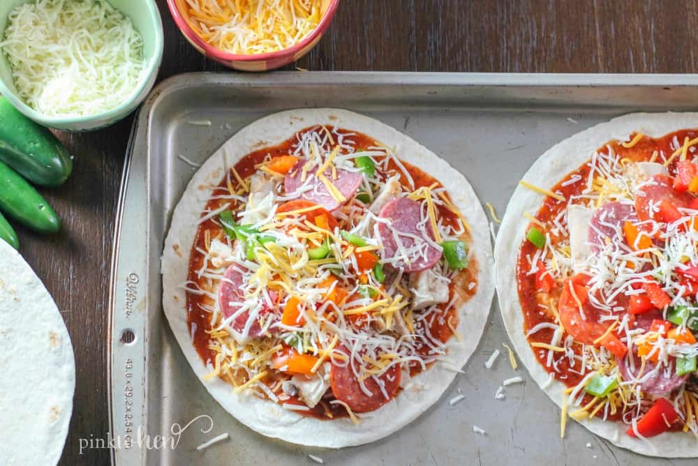 Fajita Chicken Mexican Pizza is one of my FAVORITE tailgating recipes. You can also easily change this up for so many variations. 