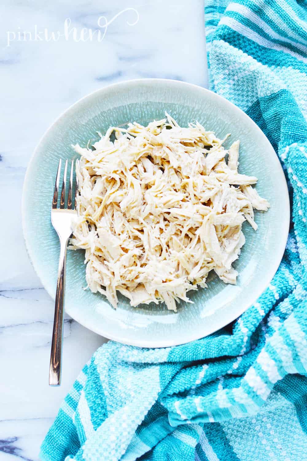 Instant Pot shredded chicken on a plate.