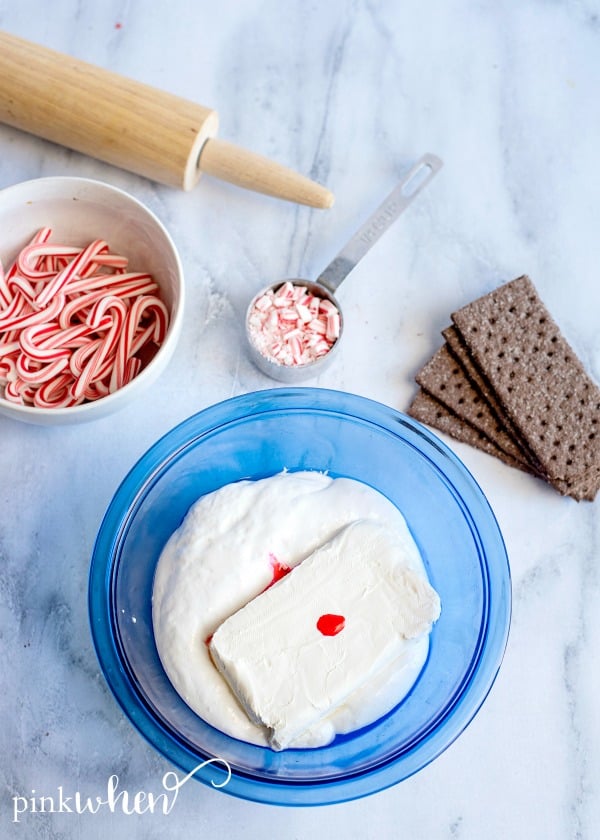 Mix cream cheese, fluff, and food coloring in a mixing bowl. 