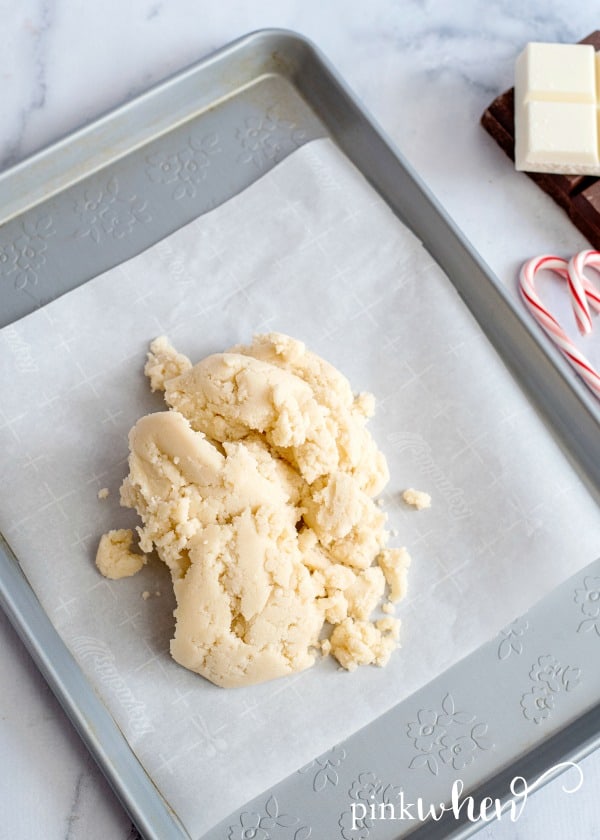 sugar cookie dough on parchment paper