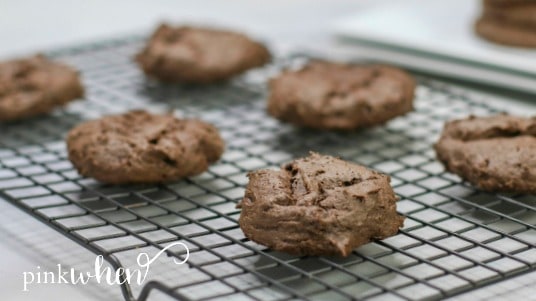 Chocolate cake mix cookies cooling on a rack.
