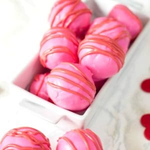 Decorated cake balls in white dish