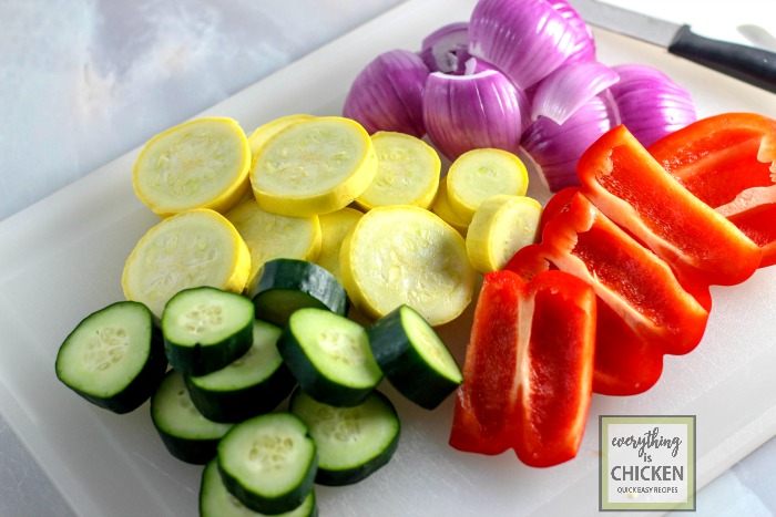 Mixed vegetables on a white cutting board. 