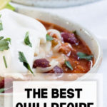 The best chili recipe topped with sour cream and onions.