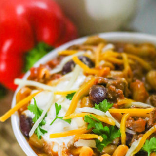 Instant Pot Chili Mac with sour cream and cheese toppings.