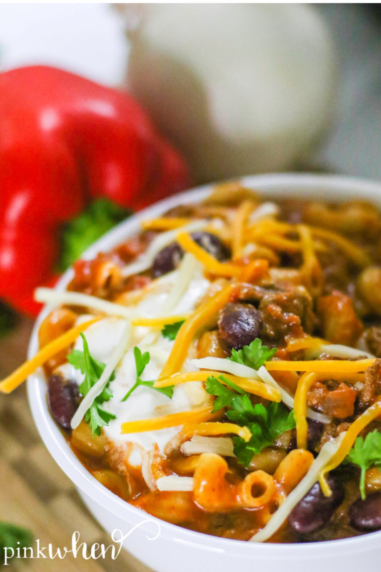 Instant Pot Chili Mac with sour cream and cheese toppings.
