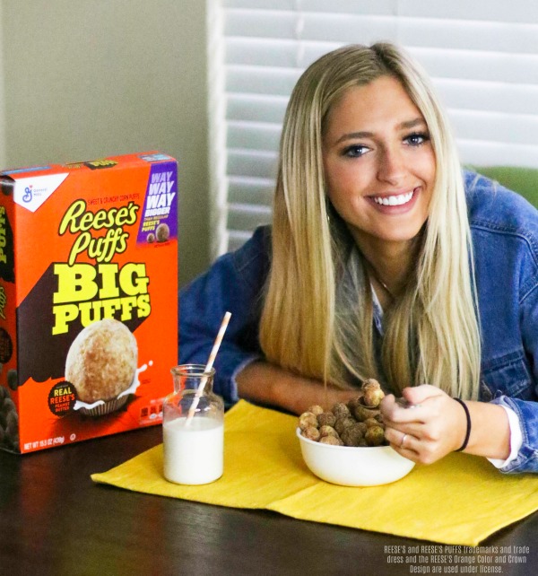 Girl eating Reese's Puffs Big Puffs cereal. 