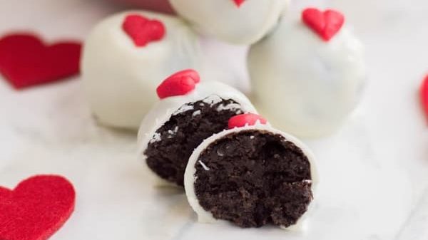 OREO Truffles in a dish with scattered red hearts.