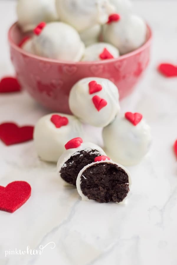 OREO Truffles in a dish with scattered red hearts. 