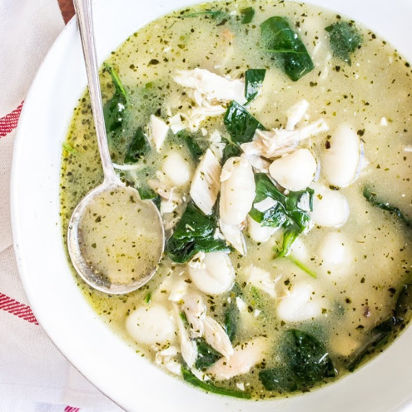 Chicken Gnocchi Soup in a bowl with a spoon.