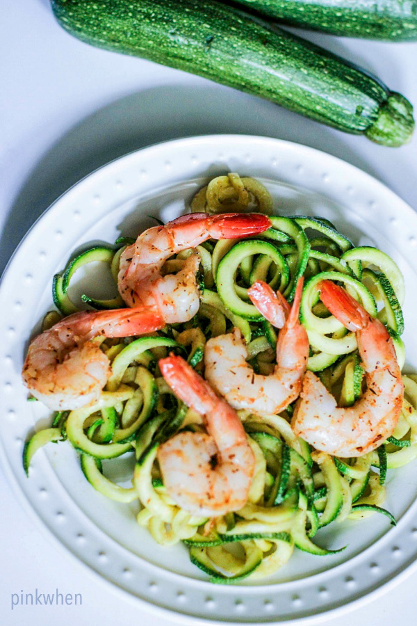 shrimp scampi and zucchini noodles on a white plate