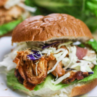 Slow Cooker BBQ Chicken served on a bun.
