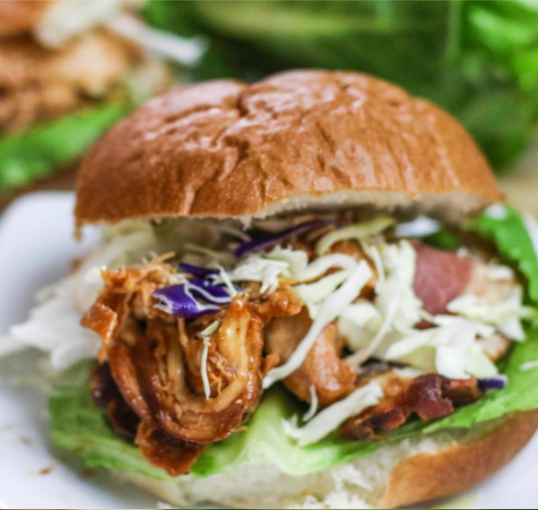 Slow Cooker BBQ Chicken served on a bun.