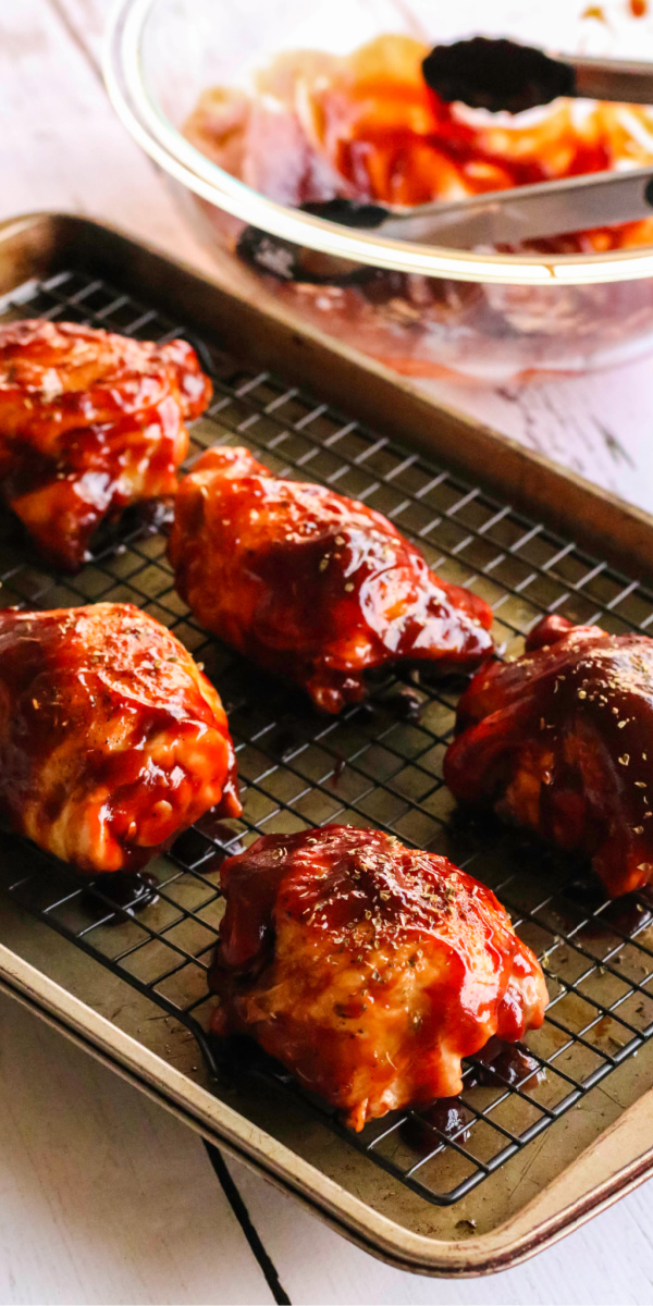 This easy oven baked bbq chicken recipe is made with just a handful of ingredients and is done in less than 30 minutes! You won't believe how juicy this chicken is, and with the perfect crisp! It's an easy recipe the whole family will love.