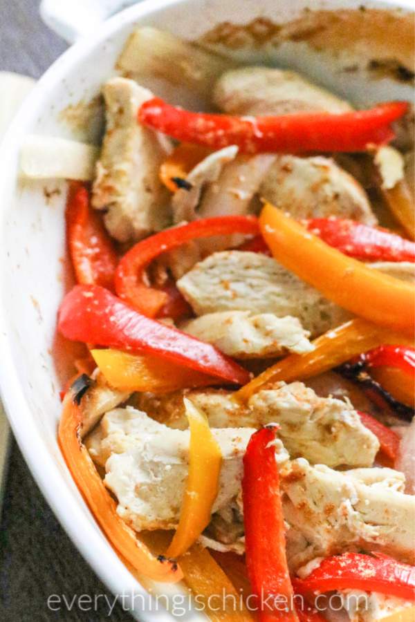 Baked Chicken Fajitas in a white serving dish.