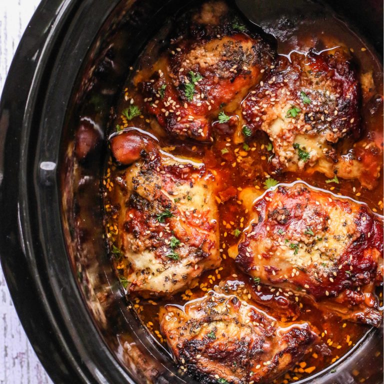 Crock Pot Chicken Thighs in the Slow Cooker topped with toasted sesame seeds.