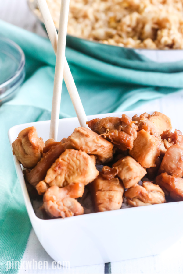 Teriyaki Chicken in a serving dish with chopsticks. 