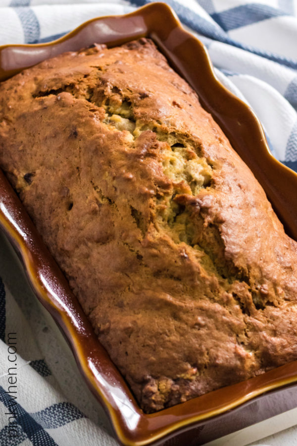 Banana bread cooked and cooling in a pan. 
