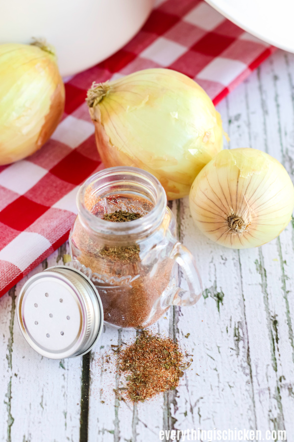 blackened seasoning on a table with onions