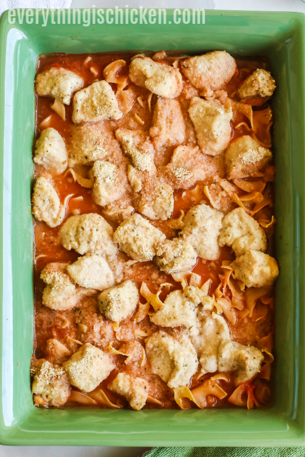 Chicken over noodles and sauce ready to bake. 